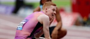 Charlie Dobson holding his hand to his mouth post race in shock